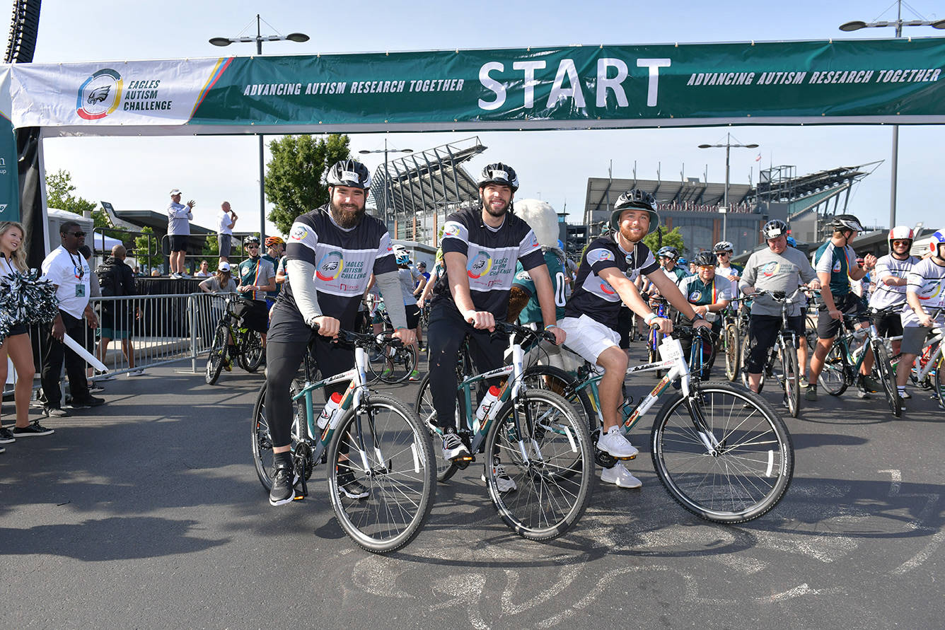 Event Three bikers at the start of the Eagles Autism Challenge bike ride
